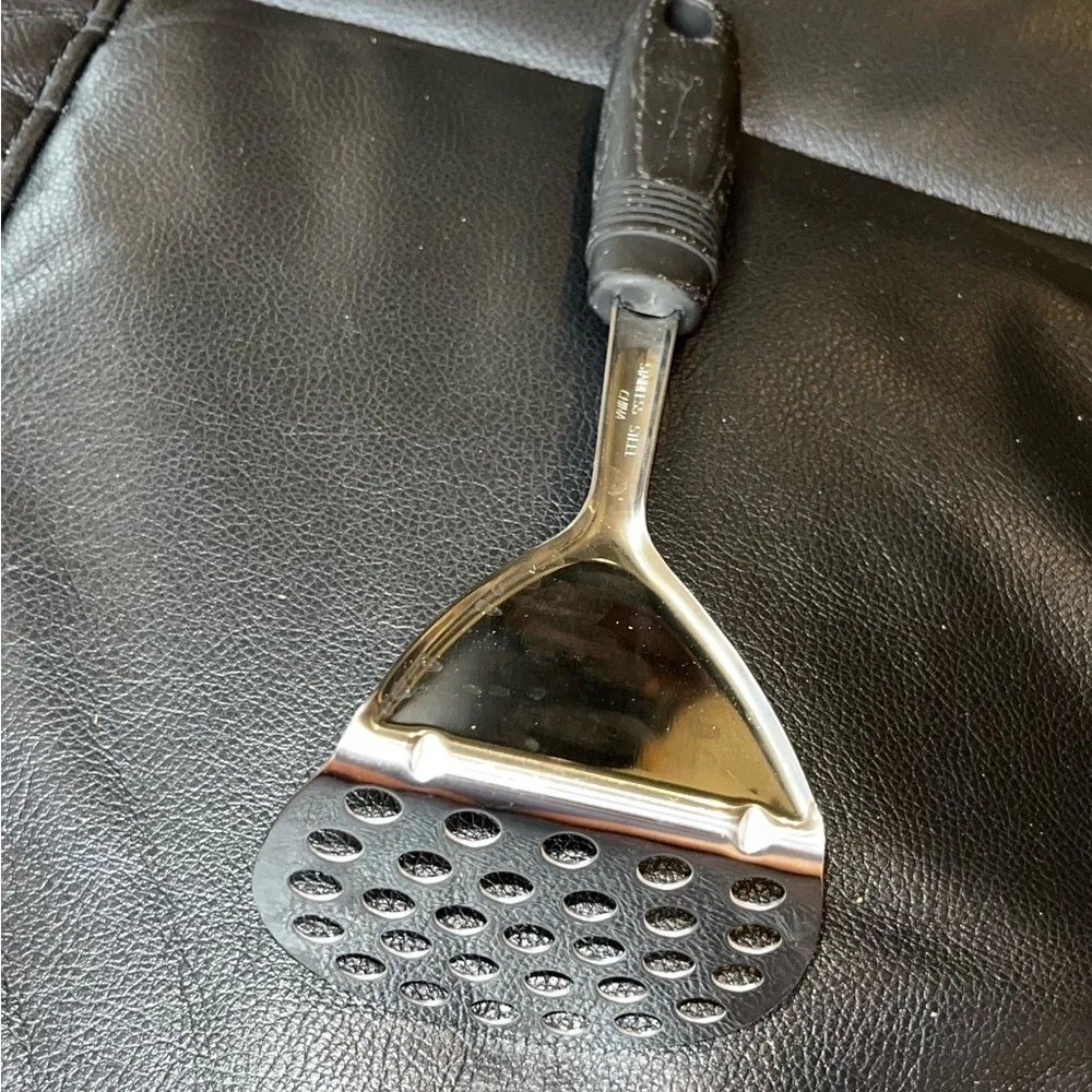 Stainless steel curved potato masher